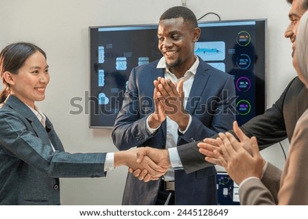 handshake after partnership meeting success business contract deal. Teamwork congratulate Handshaking for good deal contract agreement after partner sign contract in paper trust international team.