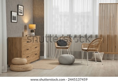 Home renovation. Room interior with stylish gray wallpaper on wall