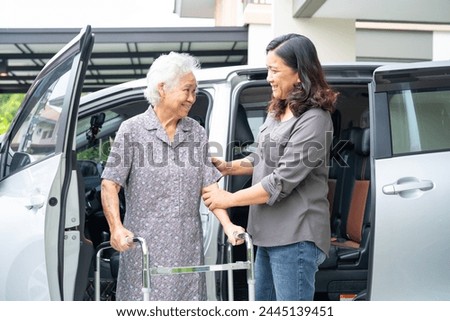 Asian senior woman patient sitting on walker prepare get to her car, healthy strong medical concept.