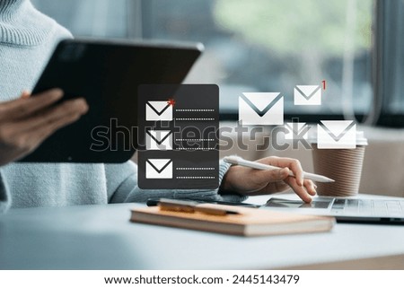 Business email marketing notification concept, Businesswoman use tablet and laptop receive message alert in the mailbox and transfer data at office.