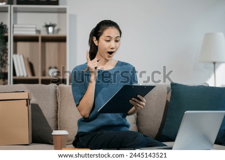 Businessman using laptop computer in office. Happy woman, entrepreneur, small business owner working online.
