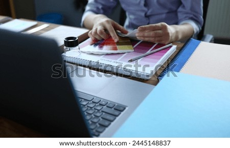 Palette 2020 spring lie on wooden office table closeup background. Choice of color solutions for home renovation. Calendar month selection trend colour advertising creative concept