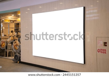 Mockup Blank LED billboard on the wall of restaurant, Empty space for insert your advertising media display show at front of restaurant near corridor in shopping mall