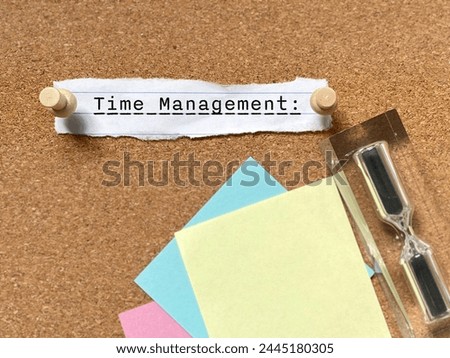 Business Concept - time management text on paper background. Stock photo.