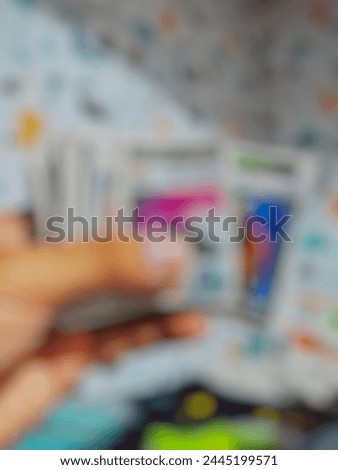photo of a child's toy card lying on the carpet and out of focus
