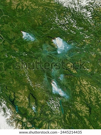 Wildfires in the Yukon. The Aqua satellite acquired this image showing large wildfires burning in the Yukon on July 14, 2013. Elements of this image furnished by NASA.