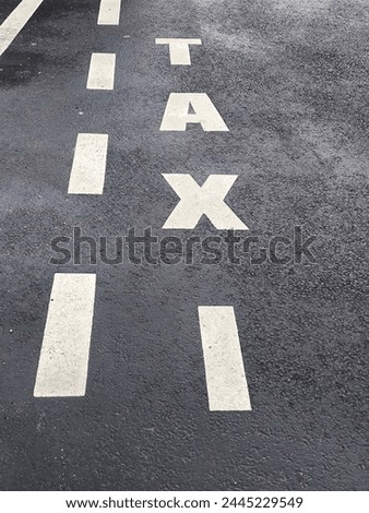 The sign "Taxi"in French that means it is the parking only for the taxi. 