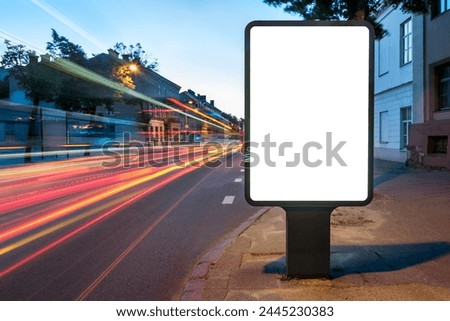 Blank Mockup Of Advertising Street Billboard Display. Poster Lightbox Screen With Blurred Light Trails In City At Night