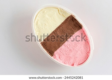Neapolitan Ice Cream or Harlequin Es Krim on Oval Bucket Packaging. Isolated on White, Top View 