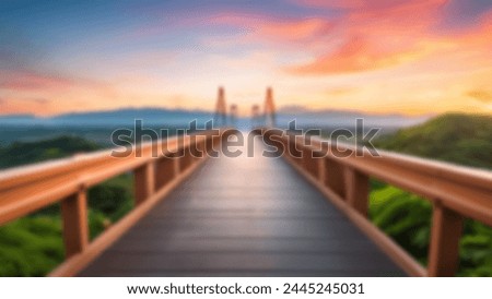 Sunset on the bridge blurred abstract background. Defocus sunrise wallpaper with beautiful sky on the river