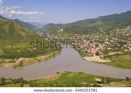 View over the Mtkvari River and Mtskheta, Georgia, Caucasus, Central Asia, Asia Royalty-Free Stock Photo #2445251781