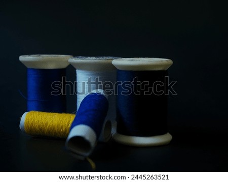 Sewing thread on a black background
