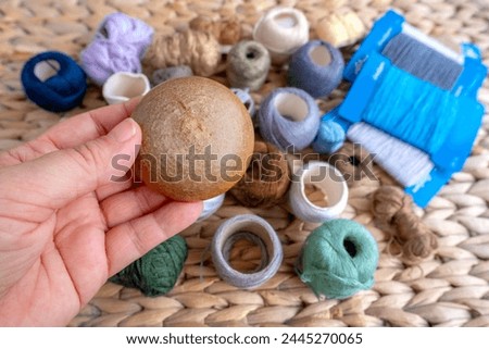Wooden darning mushroom, clothing repair materials, home needlework, Exploring Textile Restoration, Sustainable DIY Fiber Projects Royalty-Free Stock Photo #2445270065