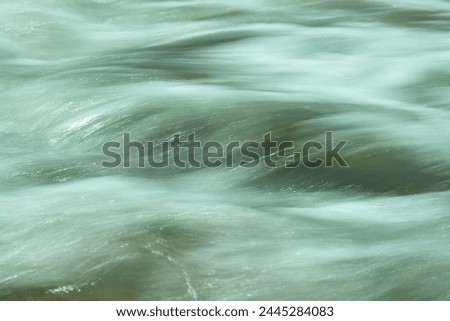 Background, texture. Abstract picture of a turquoise surf wave on the Mediterranean coast