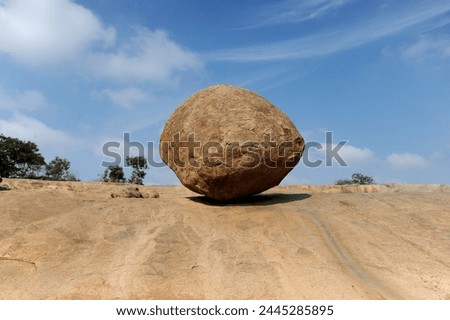 Krishna's butterball, a large granite ball which has stood on this sloping site for over 1200 years, Mammalapuram, Tamil Nadu, India, Asia Royalty-Free Stock Photo #2445285895