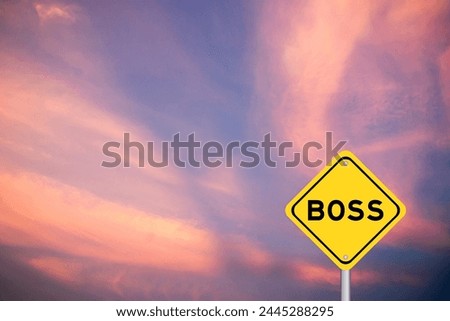 Yellow transportation sign with word boss on violet color sky background