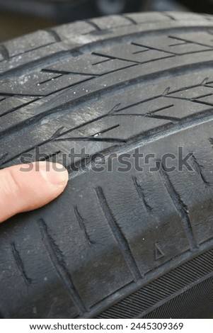 Check the triangular mark on the tire slip sign.