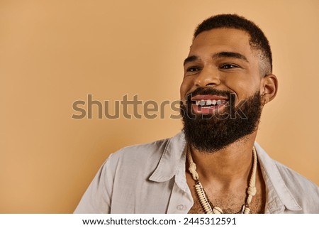 A man with a luxurious beard adorns his neck with a captivating necklace, showcasing a unique and elegant style. Royalty-Free Stock Photo #2445312591