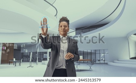 Futuristic Black Business Leader Businesswoman Standing in a Virtual Space, Gesturing with an Augmented Reality Hologram Analysing Big Data, Financial Reports, Stock Market Statistics, Infographics