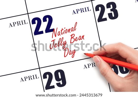 April 22. Hand writing text National Jelly Bean Day on calendar date. Save the date. Holiday. Important date.
