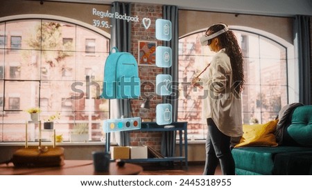 Black Woman Using Virtual Reality Headset for Online Shopping, Browsing through Stylish Handbags items. Ordering from Mock-up Internet Store App for e-Commerce products. Augmented Reality Concept.