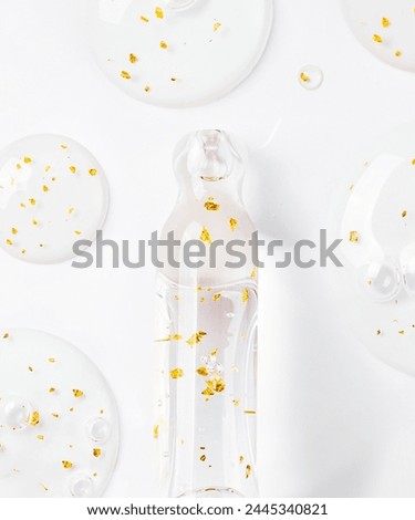 serum pipette serum gel essence texture with gold on white background Royalty-Free Stock Photo #2445340821