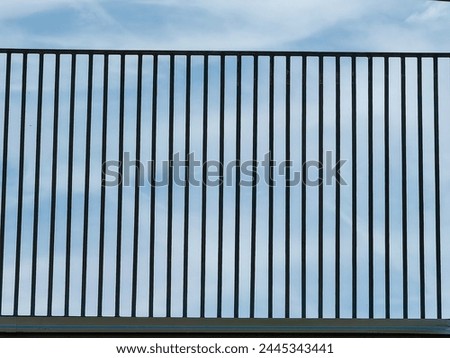 Trapped horizon. Metal frame within sky bars