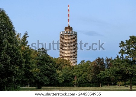 Hotel tower in Augsburg popularly called corncob in Wittelsbacher Park on a summer evening with evening glow Royalty-Free Stock Photo #2445354955