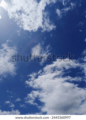 This is a background for a view of a bright sky and a collection of very cool abstract clouds.  photo taken during the day Royalty-Free Stock Photo #2445360997