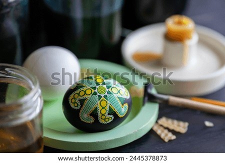 traditional creation of Ukrainian Easter eggs with wax, dyes, and a pen Royalty-Free Stock Photo #2445378873