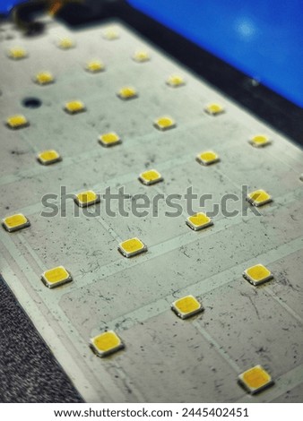 selective focus on some yellow leds on the circuit board with a blurred background