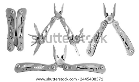 Set. Multitool. Folding multifunctional tool. Knife, pliers, taps, scabbard. Tourist tool. On an empty background. Royalty-Free Stock Photo #2445408571