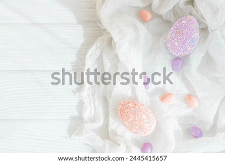 Pastel color Easter eggs on a wooden table. Easter concept flat lay. 
