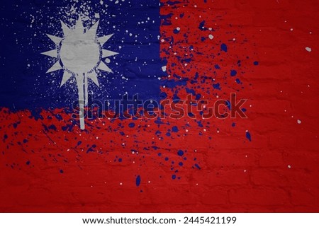 colorful painted big national flag of taiwan on a massive old brick wall