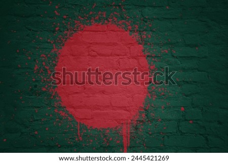 colorful painted big national flag of bangladesh on a massive old brick wall