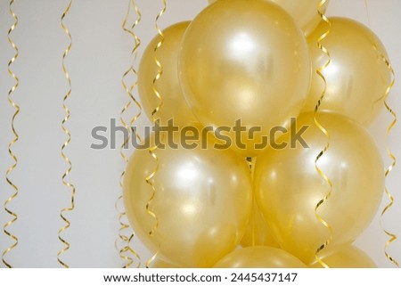 golden mother of pearl balloons in a bunch