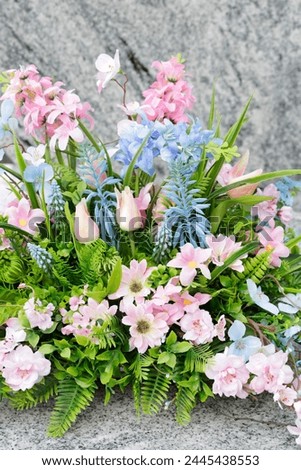 Beautiful spring decoration made of artificial flowers. Easter traditional motifs. 