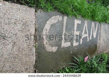 cleaning footpath in the garden with water high pressure