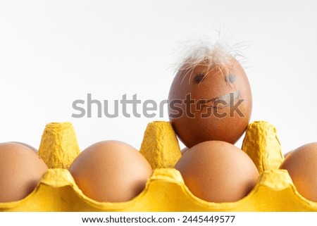 Funny background of egg with hair on the top.