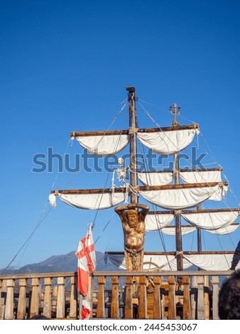 Decoration of a pleasure pirate ship. Entertainment for tourists. Ship sails and masts. Skeleton