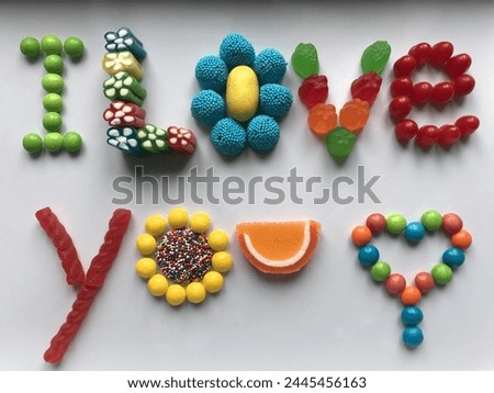 Photo of  the words "I love you," finishing off with a heart. Written in delicious, assorted, colorful candies.