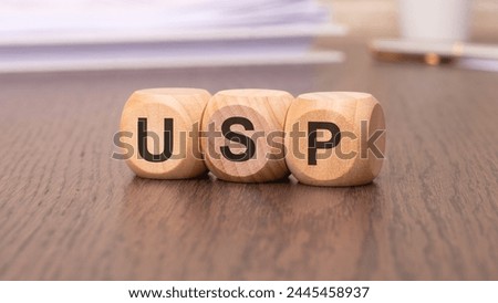 USP - Unique Selling Proposition word concept on cubes