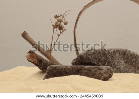 Stones, wood platform podium on beige sand background. Minimal empty display product presentation scene.