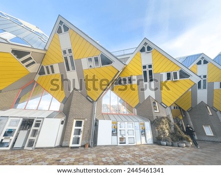 Yellow cubic houses in Rotterdam. The -kubuswoningen-in Rotterdam are a tourist attraction. Kubuswoningen in Dutch are a set of innovative houses designed.