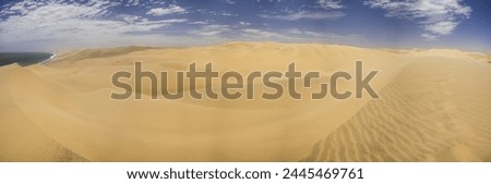 Picture of the dunes of Sandwich Harbor in Namibia on the Atlantic coast during the day in summer