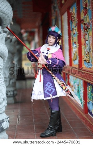Portrait of a beautiful young woman game Cosplay with Chinese dress