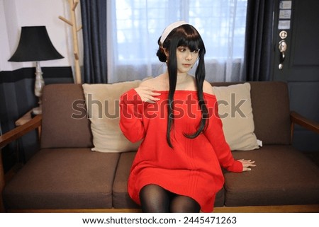 Portrait of a beautiful young woman Cosplay with red sweater at home