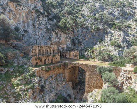 Ruins and path of the Old monastery from 11nth century in Avlaki gorge outside of Katholiko cave in Akrotiri Chania Royalty-Free Stock Photo #2445471393