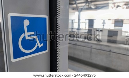 handicap sing on train station platform