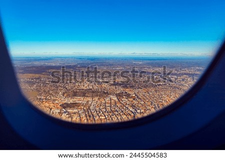 Aerial view of the city from airplane window. Valencia view from above